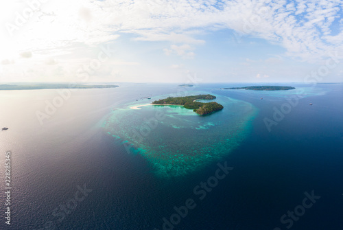 Aerial view tropical island reef. Indonesia Moluccas archipelago, Kei Islands, Banda Sea. Top travel destination, best diving snorkeling, stunning panorama.