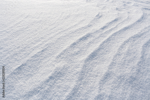 White winter wavy snowy background of snow.