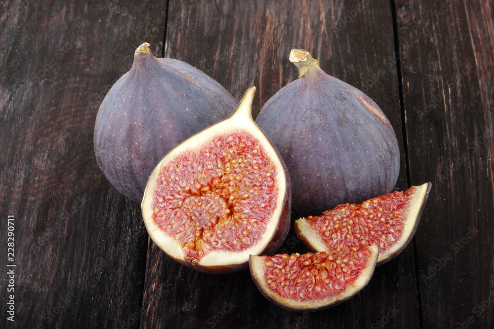 puurple figs on wooden background puurple figs on wooden background