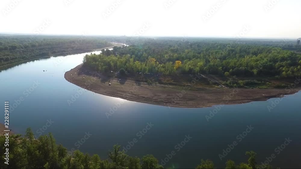 A river in the middle of a forest close to the city. Aerial survey of recreation center A river in the middle of a forest close to the city. Aerial survey of recreation center