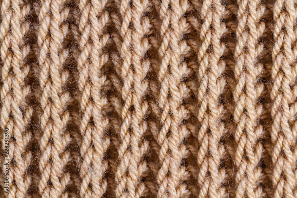The texture of brown knitted yarn. Knitted and winter clothes The texture of brown knitted yarn. Knitted and winter clothes