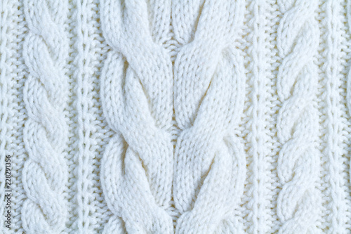 The texture of white yarn. Knitted and winter clothes