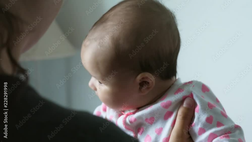 Slow Motion Of Mother Holding Cute Baby Girl In The House Slow Motion Of Mother Holding Cute Baby Girl In The House