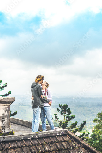 Young couple of tourists in abandoned hotel on the north of Bali island, Indonesia. photo