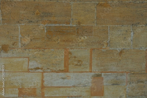 brown stone texture of large bricks in the wall
