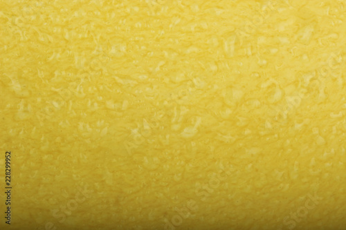 yellow mango with water drops background