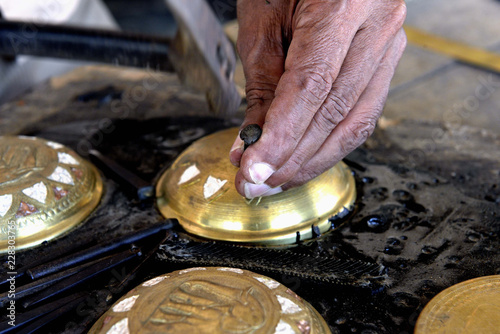 Sri Lanka. Metal carving work by an artisan. Chiselled copper jewelry box.