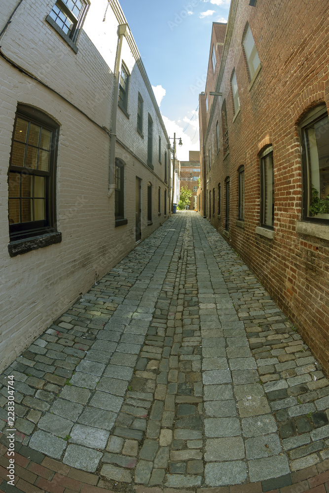 Small street with facades of typical buildings in Georgetown in Washington DC Small street with facades of typical buildings in Georgetown in Washington DC