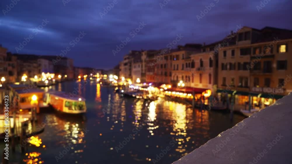 Point of view from Rialto bridge of Venice cityscape and lights along the Grand Canal Night shot of typical Venetian buildings along the water under cloudy sky 4k Point of view from Rialto bridge of Venice cityscape and lights along the Grand Canal Night shot of typical Venetian buildings along the water under cloudy sky 4k