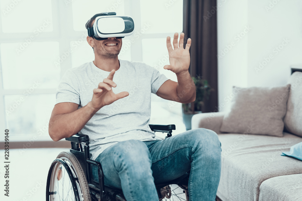 Disabled Man with Hands Up Wearing VR Goggles Disabled Man with Hands Up Wearing VR Goggles