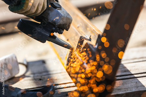 Sparks from cutting metal on the rack