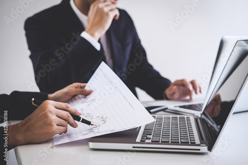 Business team investment working with computer and analysis graph stock market trading with stock chart data, business and technology concept