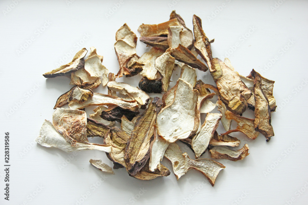 Dried porcini mushrooms on a white background. Dried white forest mushrooms, isolate. Dried porcini mushrooms on a white background. Dried white forest mushrooms, isolate.