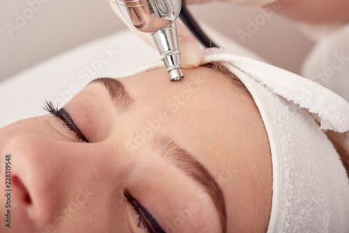 Ozone treatment with cosmetology apparat. Physiotheraphy. Lifting effect . Ozone face skin rejuvenation, regeneration of face and neck skin. Spa salon. Cosmetology room
