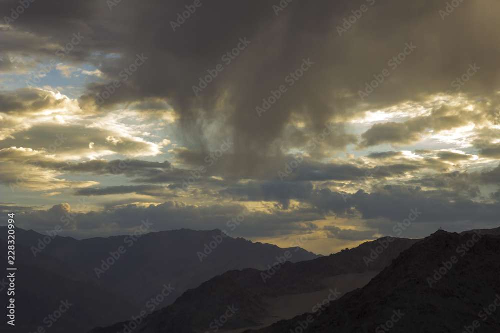 sunset light on the clouds in the mountain valley sunset light on the clouds in the mountain valley