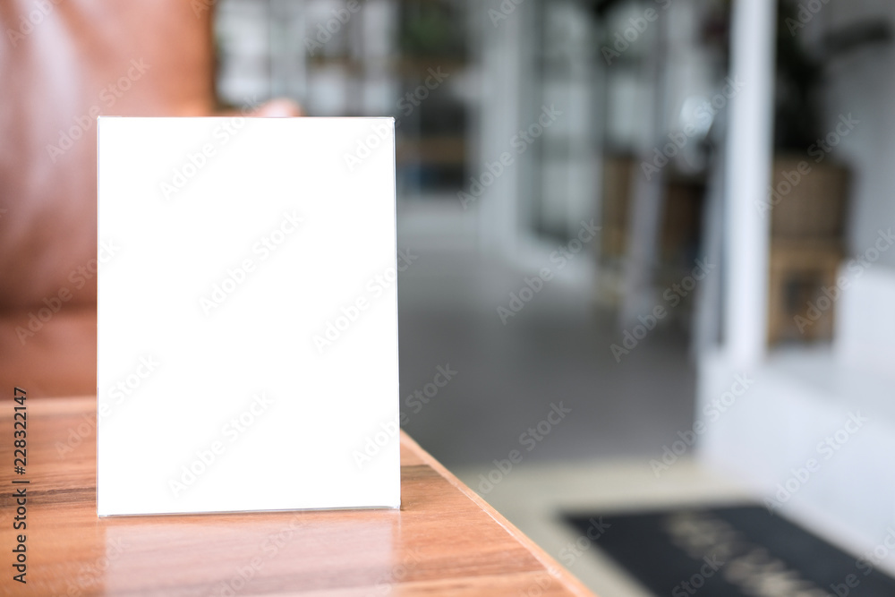 Mock up blank menu frame on table in coffee shop stand for your text of display your product Mock up blank menu frame on table in coffee shop stand for your text of display your product