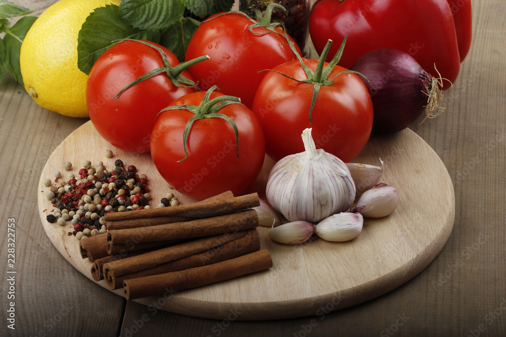 vegetables and spices on wooden background vegetables and spices on wooden background