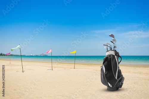 Golf bag and Golf club sea and blue sky as background . Business, Health with relaxation concepts