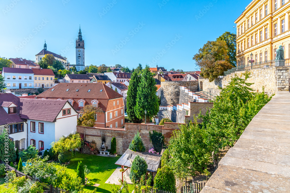 Litomerice cityscape with baroque St. Stephen's Cathedral and bell tower, Litomerice, Czech Republic. View from fortification walls and baileys.