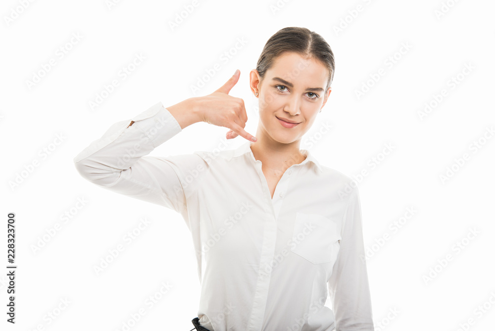 Young pretty business woman showing call me gesture Young pretty business woman showing call me gesture