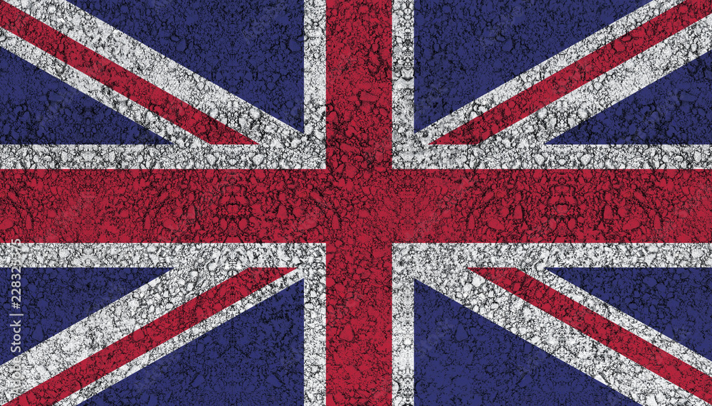 Fototapeta premium Flag of the United Kingdom drawn with paint on road asphalt