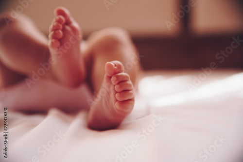 Close up of infant baby feet. © SianStock