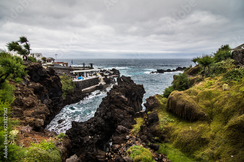 Lava rocks natural volcanic pools in Porto Moniz, Madeira, Portugal. photo