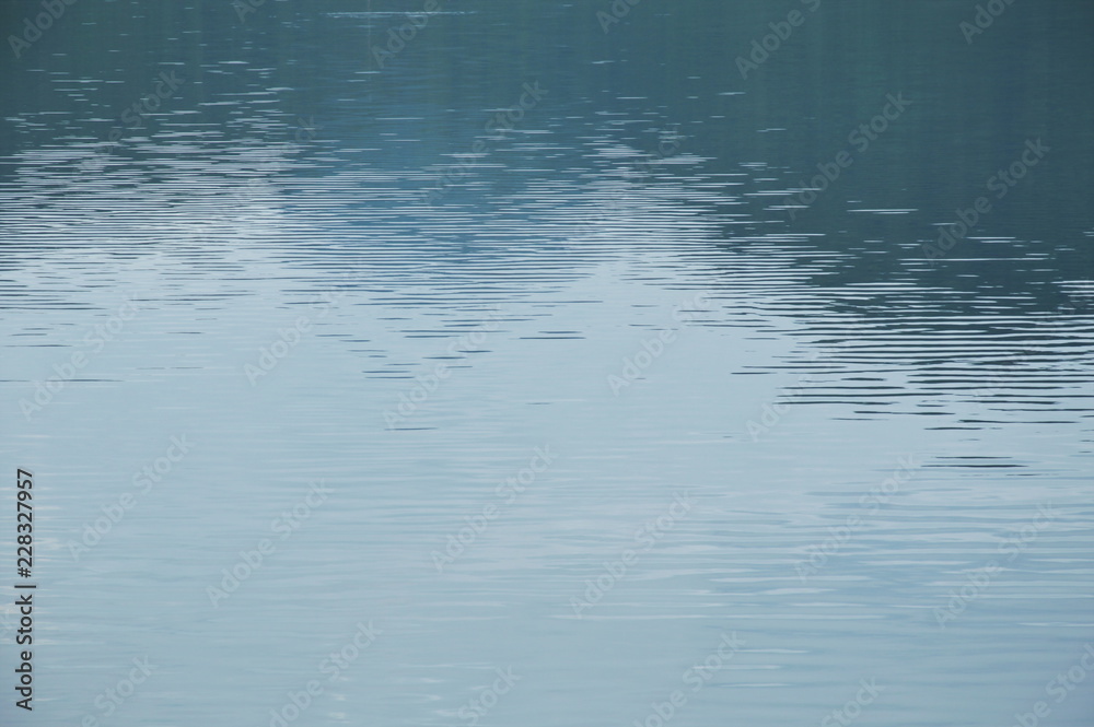 water rippled and spreading on lake background and texture