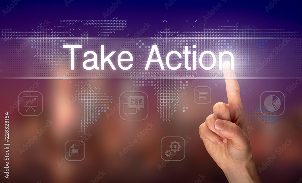A hand selecting a Take Action business concept on a clear screen with a colorful blurred background. A hand selecting a Take Action business concept on a clear screen with a colorful blurred background.