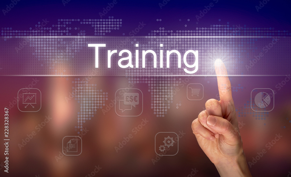 A hand selecting a Training business concept on a clear screen with a colorful blurred background.