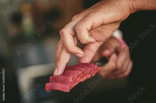 Obraz na płótnie Crop chef serving tuna fish w salonie