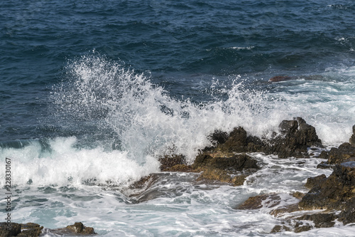 waves crashing on rocks