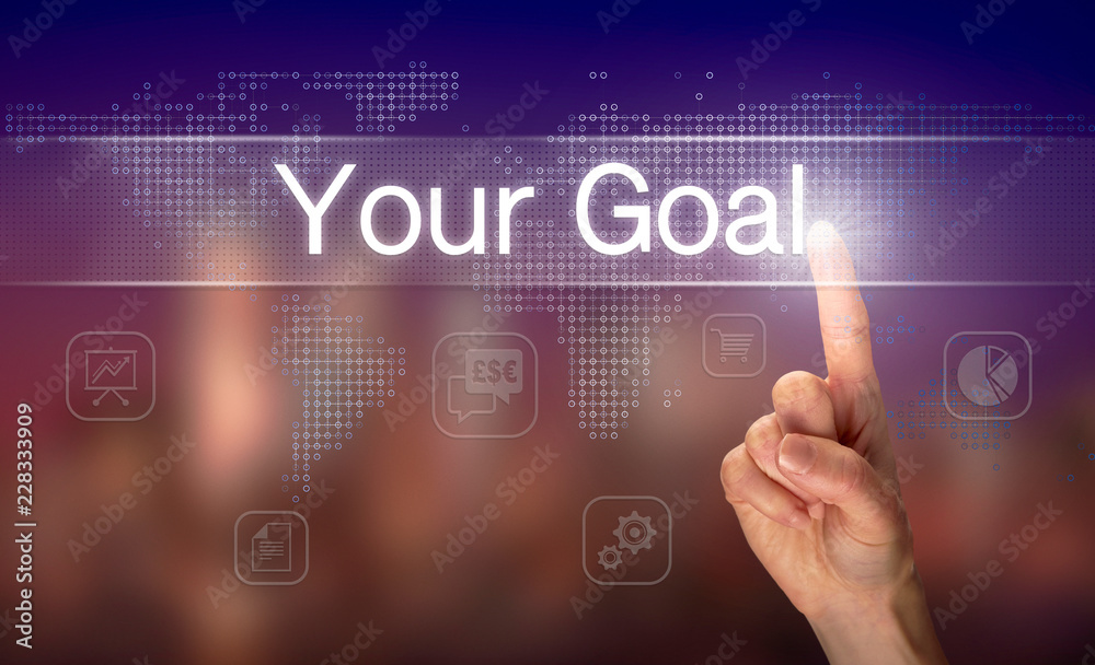 A hand selecting a Your Goal business concept on a clear screen with a colorful blurred background.