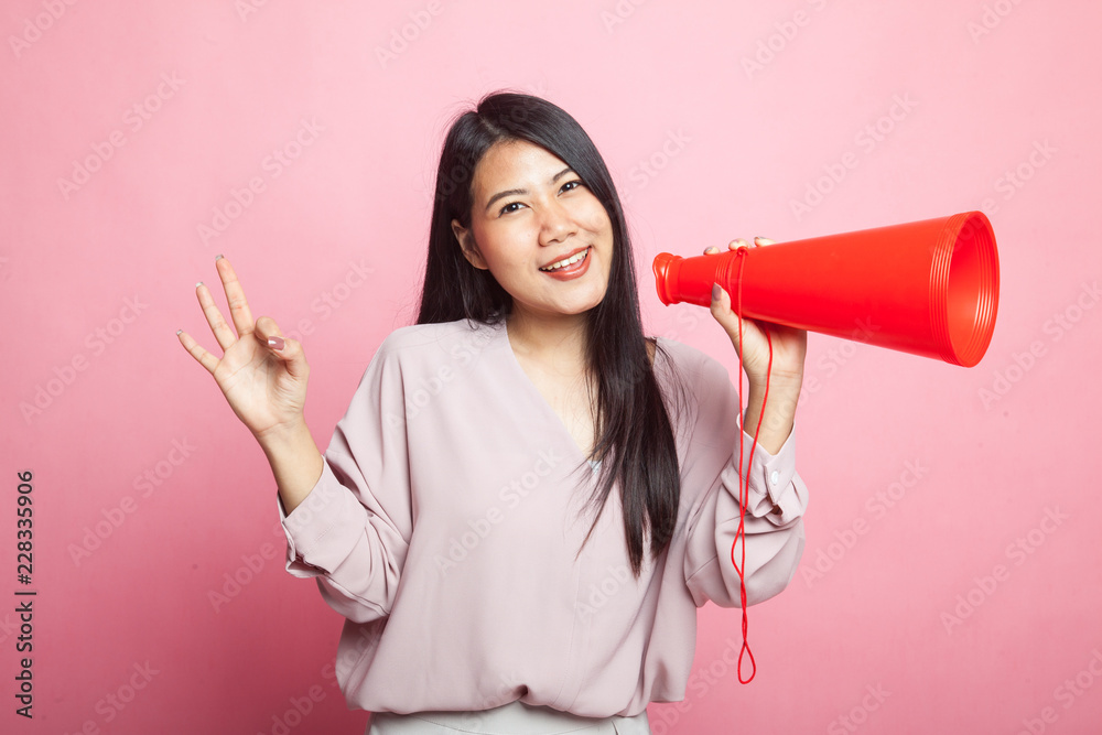 Beautiful young Asian woman show OK announce with megaphone. Beautiful young Asian woman show OK announce with megaphone.