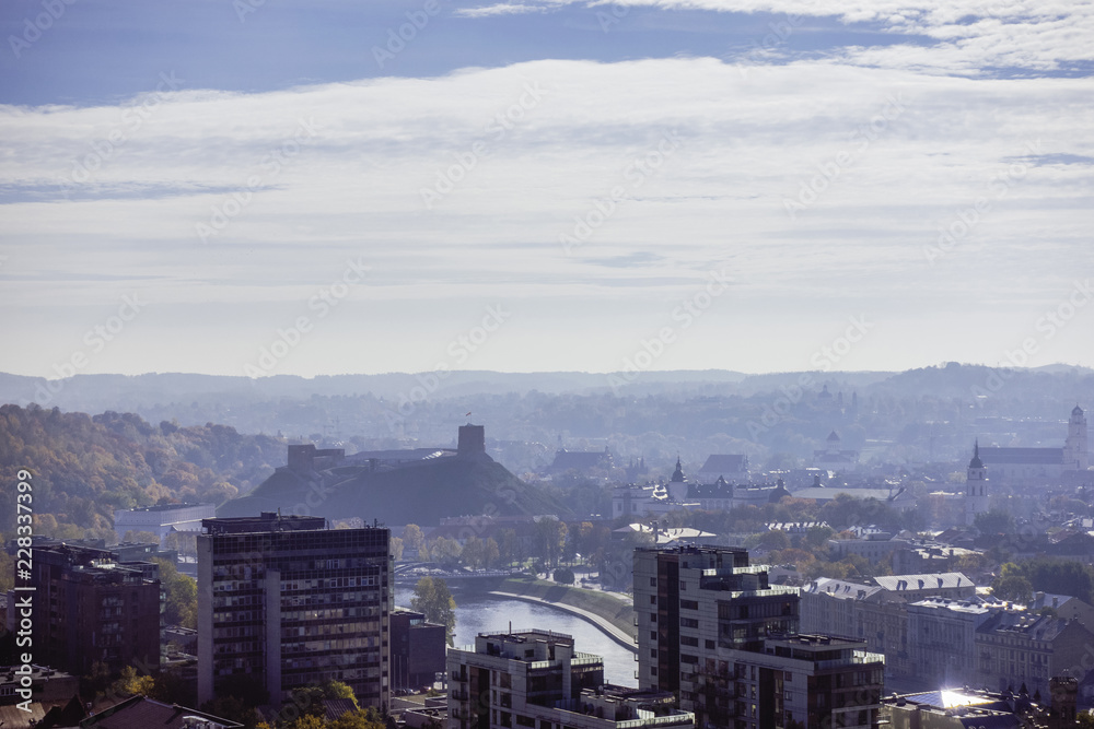Fototapeta premium Lithuania, Vilnius cityscape in foggy autumn day