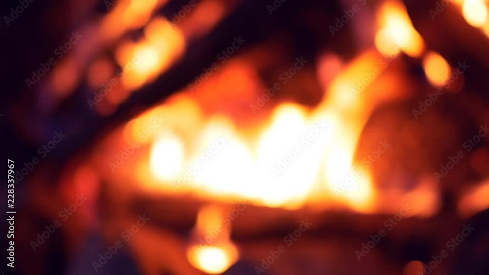 UHD out of focus shot of the burning fireplace UHD out of focus shot of the burning fireplace