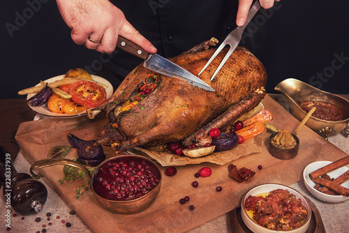 Roasted stuffed goose with herbs berries and vegetables. Ready to Christmas time.