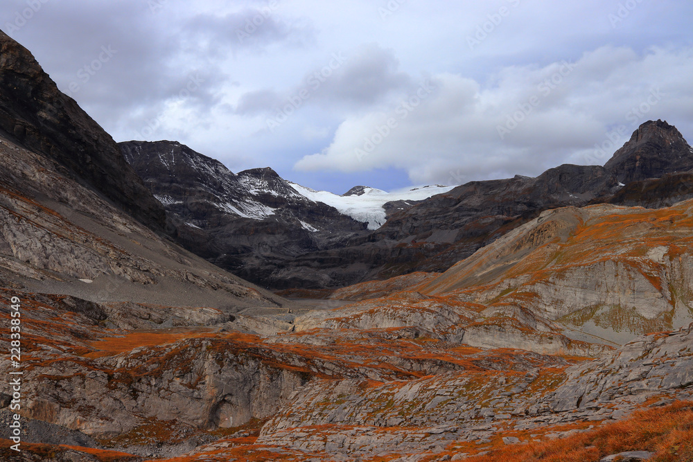 Autumn colors in the high mountains of Switzerland. Gemmi Pass (2,270 m / 7,448 ft) near Leukerbad, canton of Valais, Switzerland.