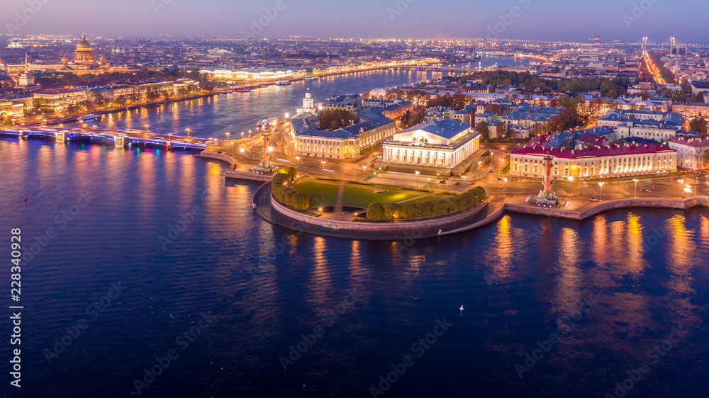 Aerial view Vasilievsky Island with Rostral columns, Palace bridge or Dvortsovy bridge, and Saint Isaac Cathedral across Moyka river, St Petersburg, Russia