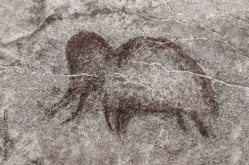 image of an ancient mammoth on the wall of the cave. ancient history, archeology.