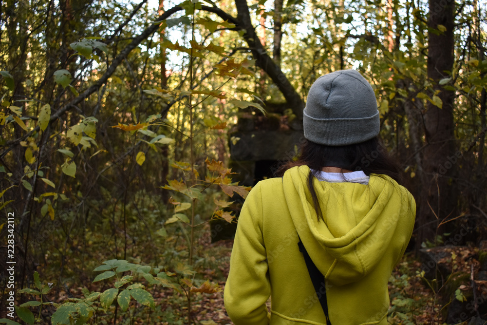 Fototapeta premium A lady came across an old stack of bricks or rocks known by the locals as the 
