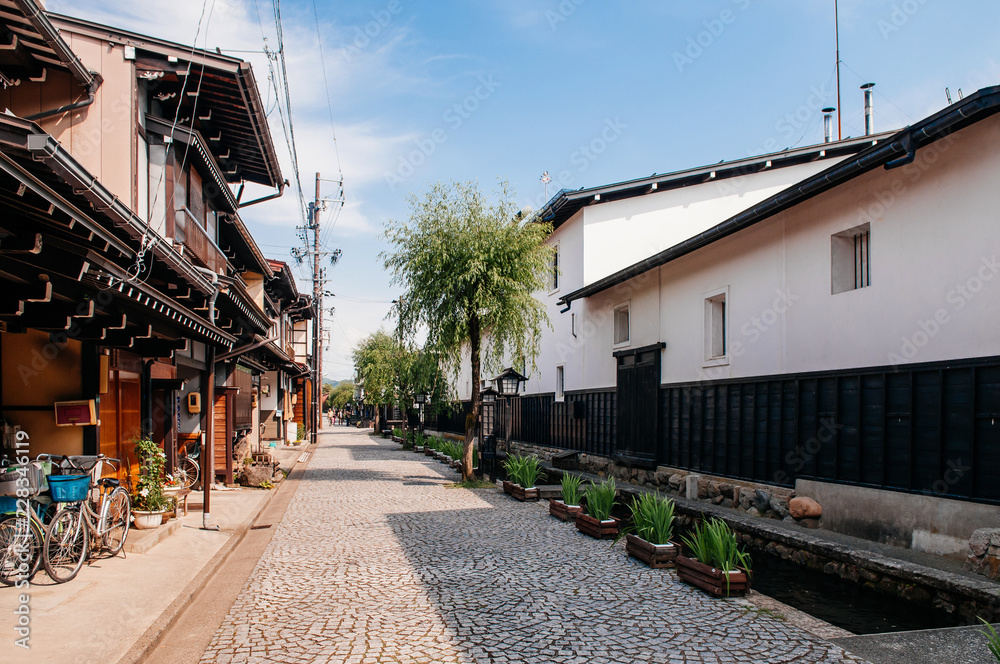 Old houses and Japanese tourist on street of Hida Furukawa old town, Gifu. Japan Old houses and Japanese tourist on street of Hida Furukawa old town, Gifu. Japan