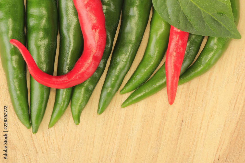 heap of chili pepper on wooden background