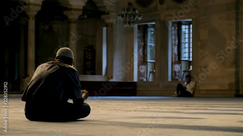 Man Praying Inside The Mosque  photo