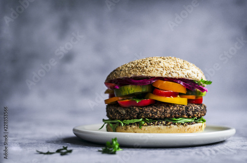 Mexican burger with lime slice served on plate photo