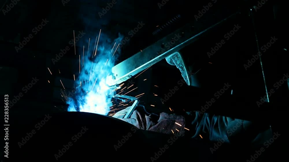 Professional worker welding metal construction Professional worker welding metal construction