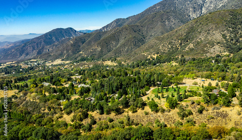 Aerial  drone view of Oak Glen located between the San Bernardino Mountains and Little San Bernardino Mountains with several apple orchards before the Fall color change