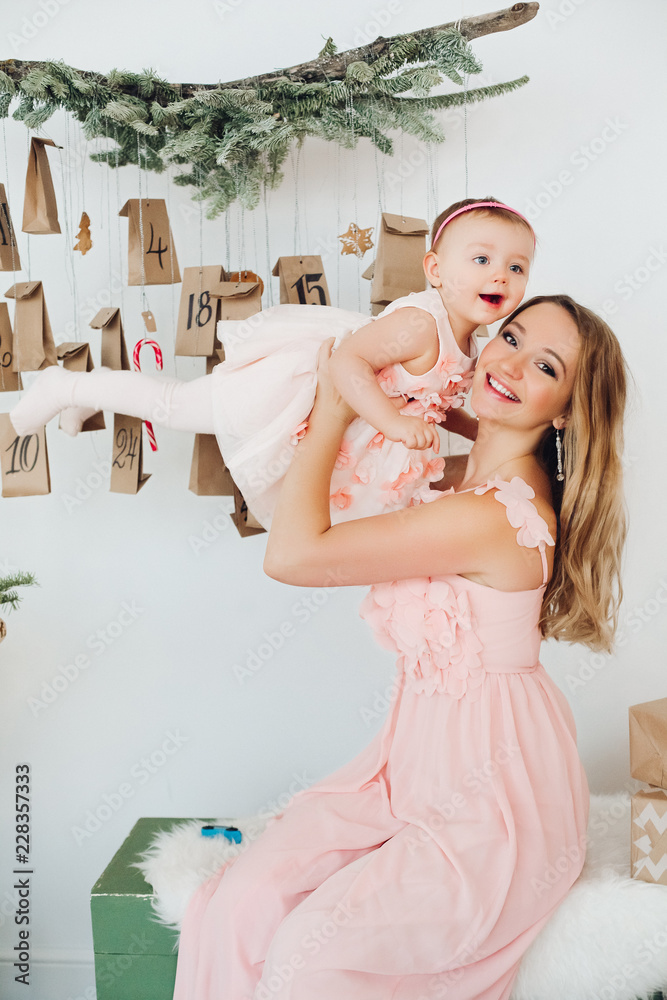 Mom Daughter Wearing Pink Dresses Holding Christmas Gifts Mom Daughter  Stock Photo by ©luzgareva 176452092