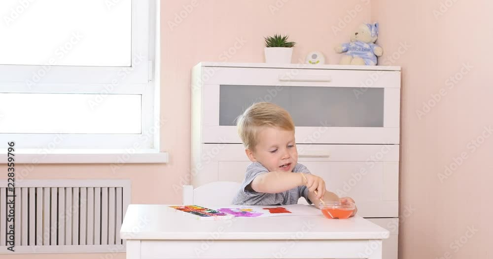 Three years old little boy painting in watercolor Three years old little boy painting in watercolor