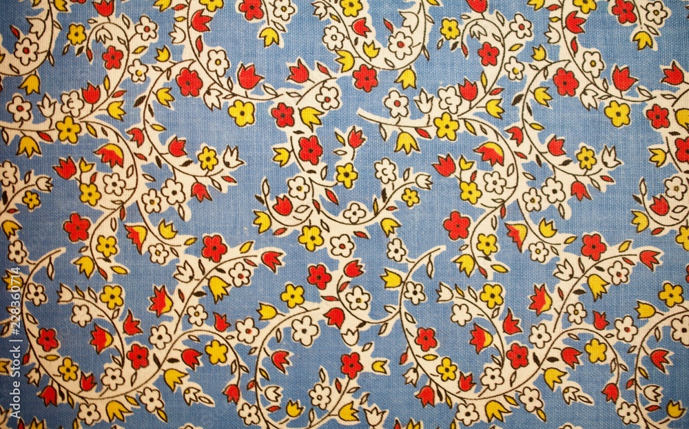 Fragment of colorful retro tapestry text. Fabric striped, flowered texture. Fragment of colorful retro tapestry text. Fabric striped, flowered texture.